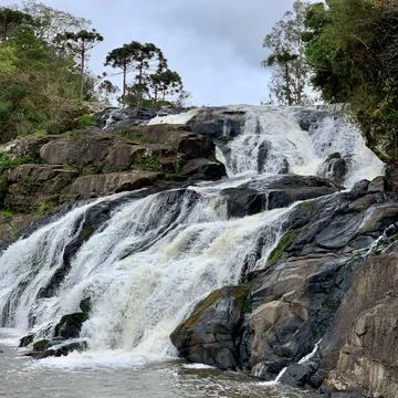 Stone river waterfall seen from below Stock Photos