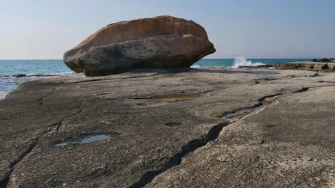 Stone rock on the Caspian seashore tracking shot 4K Stock Footage 84566133