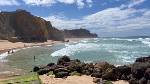 Stone rock at ocean side beach in a summer day. Stock Footage 249955103