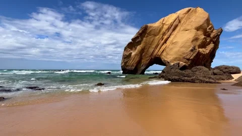 Stone rock at ocean side beach in a summer day. Stock Footage 249955138