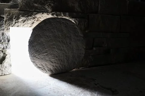 Stone rolled from empty tomb representing resurrection Stock Photos