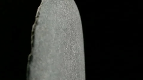 Stone Rotates On Black Background Close-up Stock Footage 93016357
