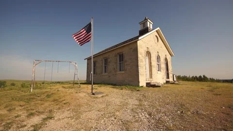 Stone School with Flag Stock Footage 134655856