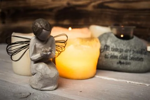 Stone with scripture candle light and angel Stock Photos