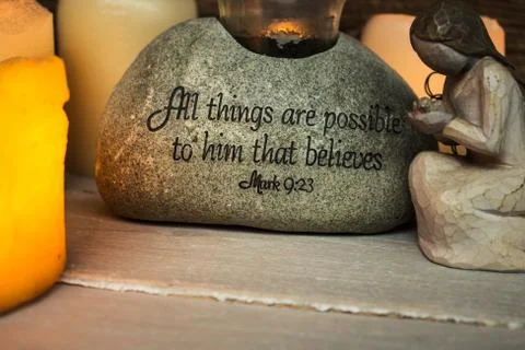 Stone with scripture candle light and angel Stock Photos