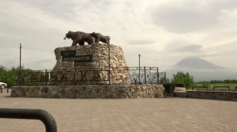 Stone sculpture of two bears and fish with the headline "Russia begins here" Stock Footage 67864546