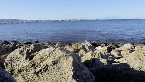 Stone seashore. View of Mount Etna Stock Footage 95808403