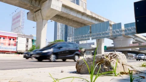 Stone On The Side Walk Between A Lot Of Vehicles Or Car Traffic Stock Footage 262145830
