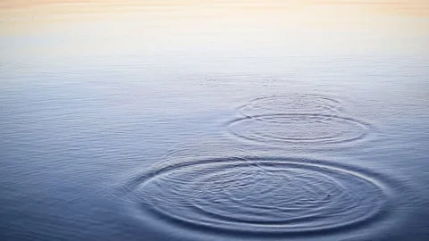 Stone skipping on water at dawn Stock Footage 72131334