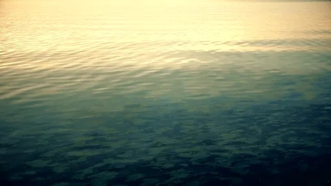 Stone skipping on water surface Stock Footage 71266457