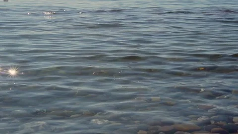 Stone Skipping On Water Surface. Reflection Of Sunset In Water. Slow motion. Stock-Footage 119540652