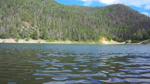 Stone Skips Across Surface of Mountain Lake Stock Footage 66524018