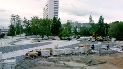 Stone slabs and construction debris lie around park Stock Footage 246472268