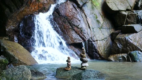 Stone sort successful concept ,  blurred defocus  clear cold  waterfall flow Stock Footage 95657445