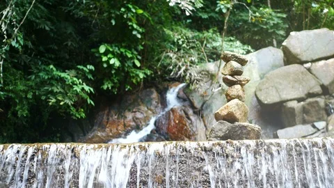 Stone sort successful concept ,  blurred defocus  clear cold  waterfall flow Video stock 95658596