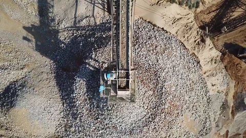 Stone sorting conveyor belt in a large Quarry - Top down aerial view Stock Footage 84509164