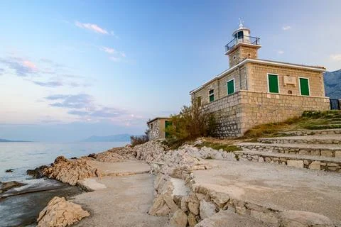 Stone St. Peter lighthouse on Adriatic sea in Makarska riviera in Croatia Stock Photos