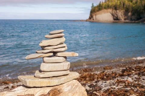 Stone stack on beach with faded retro filter Stock Photos