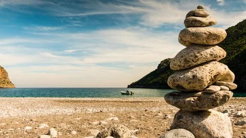 Stone stack on beach sea shore. Stock Photos