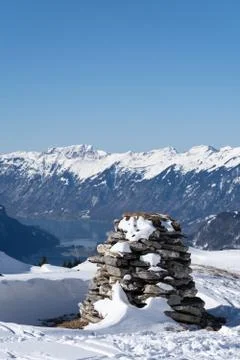 Stone stack in bernes alps, snow caped mountains Interlaken, lake brienzersee. Stock Photos