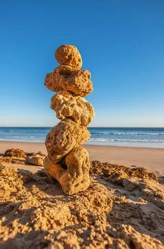 Stone stack on an empty coastline Stock Photos