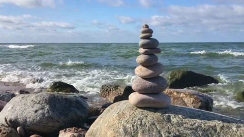 Stone stack near waving sea Stock Footage 161984643