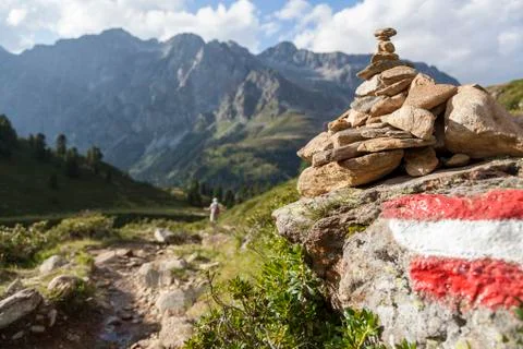 Stone stack next to hiking trail, Austrian/Italian Alps. Stock Photos