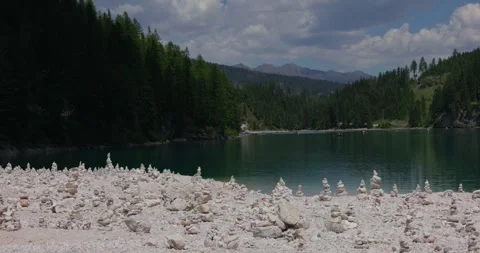 Stone Stack on Shores of Lago di Braies - Dolomites - South Tyrol - Italy Stock Footage 339782635