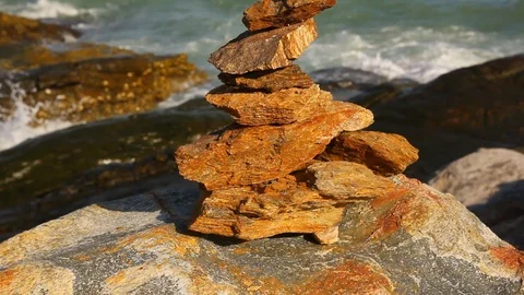 Stone stack stable and wave splash on background at Khao Laem Ya, Rayong, Thaila Stock Footage 105599491