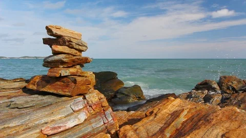 Stone stack stable and wave splash on background at Khao Laem Ya, Rayong, Thaila Stock Footage 105599506