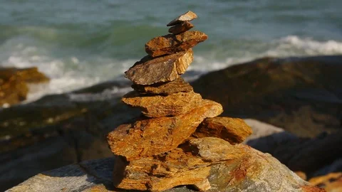 Stone stack stable and wave splash on background at Khao Laem Ya, Rayong, Thaila Stock Footage 105599530
