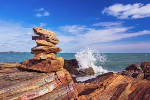 Stone stack stable and wave splash on background Stock Photos