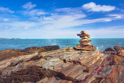 Stone stack stable and wave splash on background Stock Photos