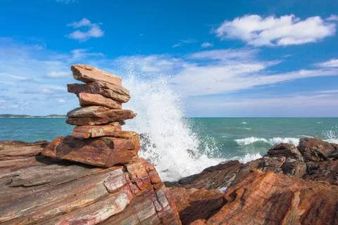 Stone stack stable and wave splash on background Stock Photos