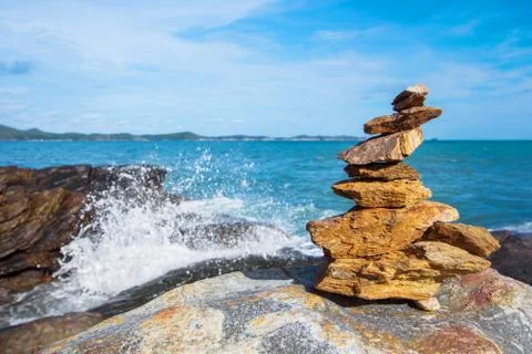 Stone stack stable and wave splash on background Stock Photos