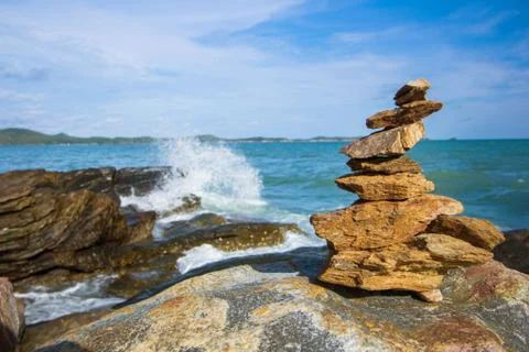 Stone stack stable and wave splash on background Stock Photos
