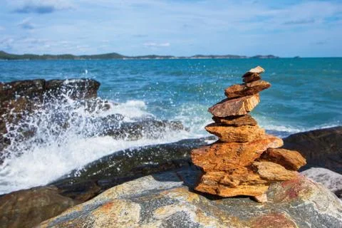 Stone stack stable and wave splash on background Stock Photos