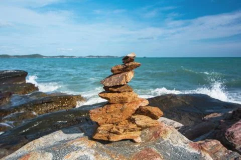 Stone stack stable and wave splash on background Stock Photos