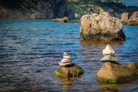 Stone stacking on the coast Stock Photos