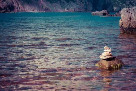 Stone stacking on the coast Stock Photos