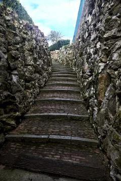 Stone staircase bordered by stone walls in a park Stock Photos