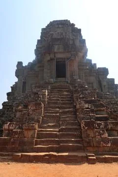 Stone stairs leading from red sand up to top of temple in angkor wat, cambodia Stock Photos