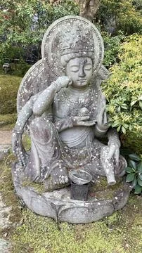 Stone statue of a Buddhist deity Stock Photos