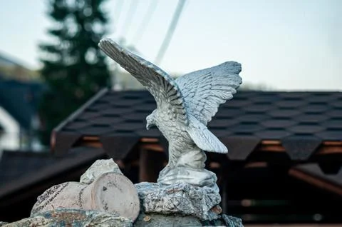 Stone statue of eagle in the outdoor space Stock Photos