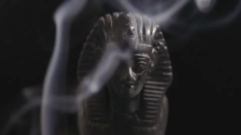 Stone statue of the Egyptian sphinx in smoke on a black background Stock Footage 210450325