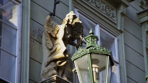 Stone statue of grey colour on old building wall at sunlight Video stock 125850960