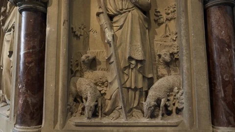 Stone Statue of Jesus Christ Shepherd with Sheep. Decorations in Old Gothic Video stock 129229270