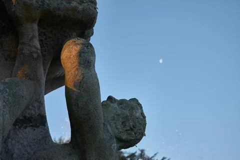 Stone statue with the moon Stock Photos