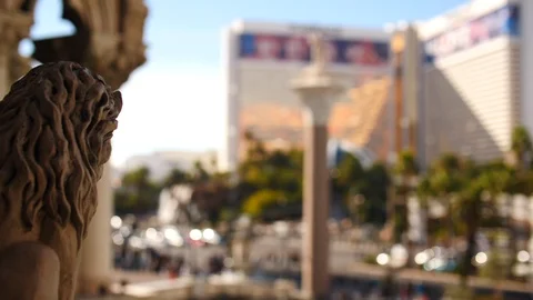 Stone statue over the top of Las Vegas palm trees sunny Stock Footage 105226119