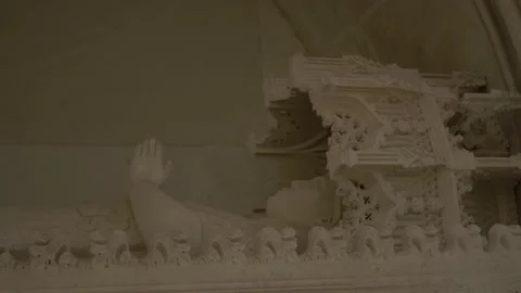 Stone statue of woman lying down with her hands together. Stock Footage 163379782